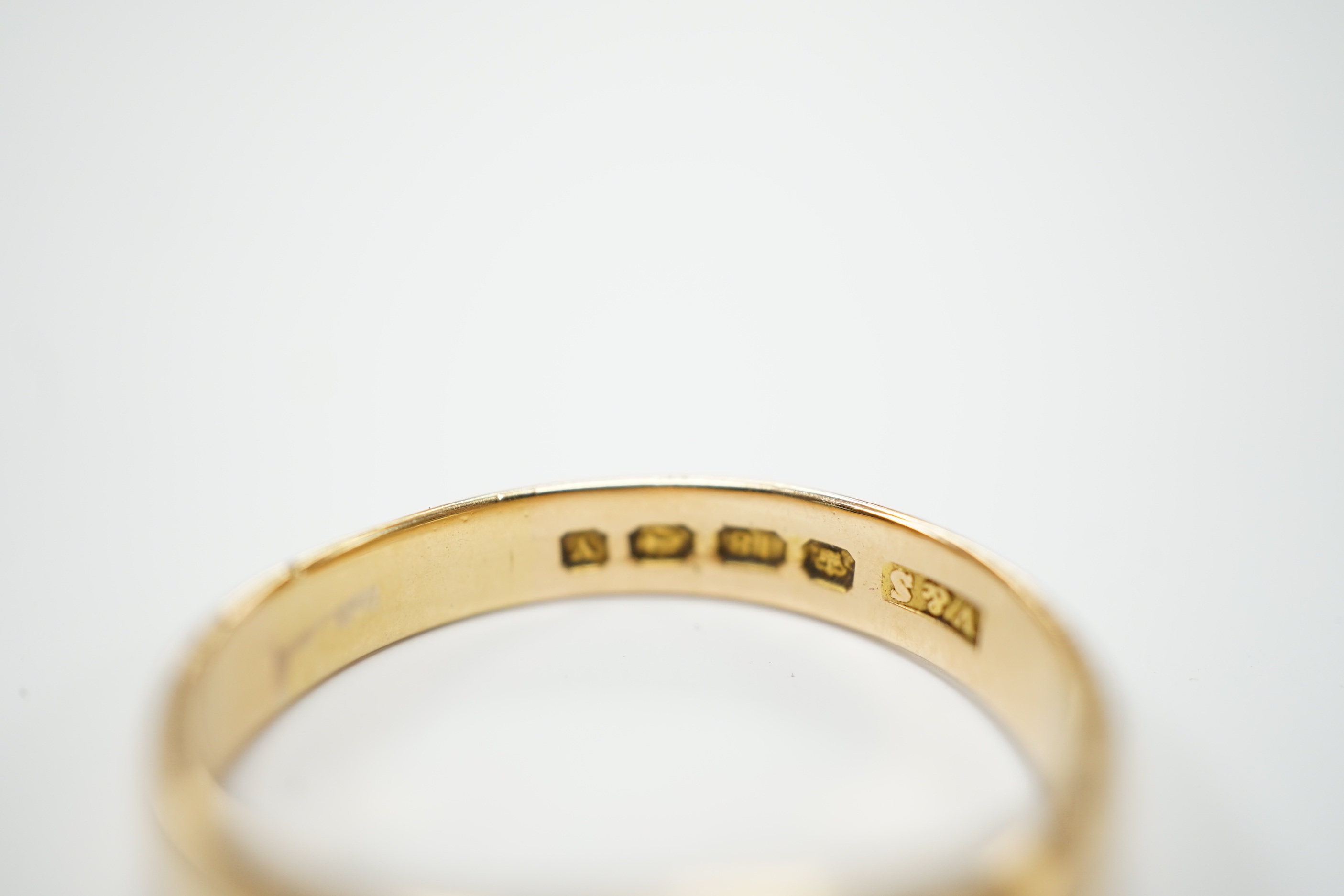 A George V 18ct gold and claw set solitaire diamond ring, size W, gross weight 7.2 grams.